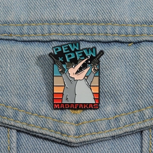 Funny enamel pin on denim jacket showing a cartoon opossum with guns and Pew Pew text