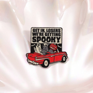 Spooky Halloween enamel pin featuring cartoon ghosts and pumpkin in a red car charm
