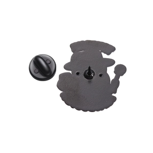 Detail view of the metal pin badge back with anti-slip texture and black rubber clutch