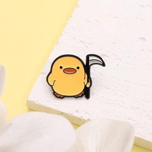 Creative cartoon yellow duck enamel pin holding a scythe, unique metal animal brooch