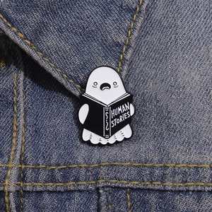 Ghost reading Human Stories book cartoon enamel pin on denim jacket lapel badge