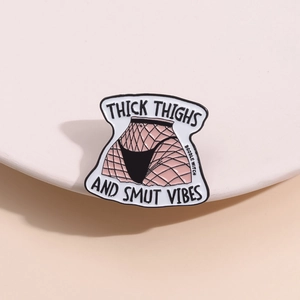 Thick Thighs and Smut Vibes enamel pin badge in black and white with metal back