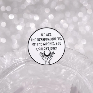 White enamel feminist pin badge with witch granddaughters quote and moon illustration