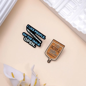 Creative medical enamel pins featuring a dagger and infusion bag for clothing accessories