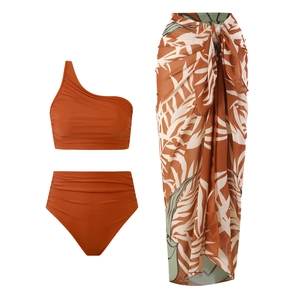 Caramel brown one-shoulder high-waisted bikini set with leaf print wrap sarong