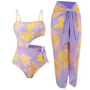 Gradient floral one-piece swimsuit with matching purple and yellow sarong wrap