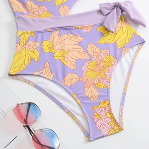 Detailed view of high waisted lavender floral bikini bottom with side tie bow detail