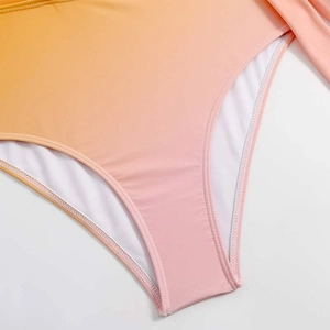 Close-up of the fine double-needle stitching and white lining on gradient swimsuit