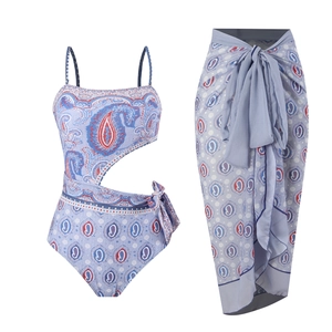 Detail of blue paisley one-piece swimsuit with matching chiffon sarong wrap and side tie