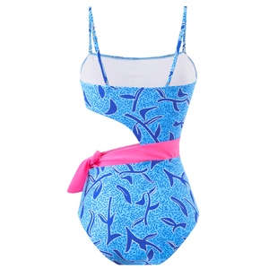 Detail view of the back of a blue floral swimsuit with waist cutout and pink bow tie