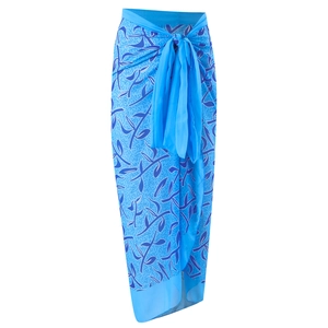 Detail of light blue sarong with dark blue abstract leaf pattern and wide waist tie