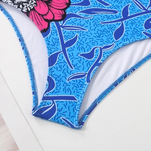 Detailed close-up of tropical floral print swimsuit with high-density stitching and lining
