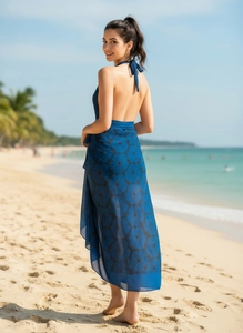 Detail of navy blue floral chiffon beach wrap skirt featuring a backless halter design
