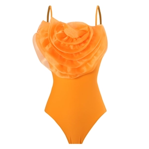 Detail view of a large 3D orange organza rose on a slim fit strappy bodysuit swimwear