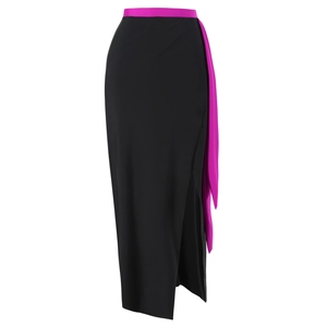 Detailed view of black side-slit maxi skirt with hot pink waist sash and ribbon accent