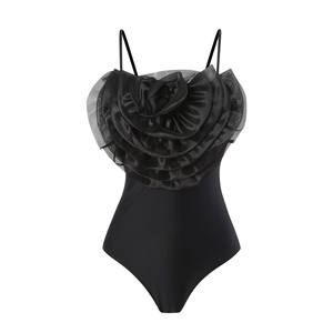 Detail of 3D layered flower ornament on black one-piece swimsuit with mesh mesh fabric