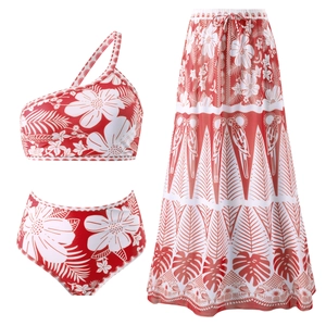 Three-piece red floral bikini set with one-shoulder top and matching sarong mesh skirt