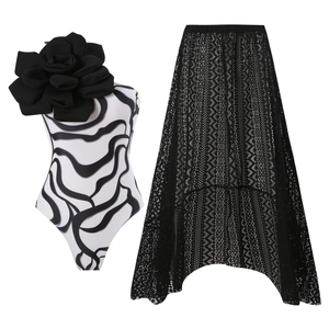 Floral one-piece swimsuit with 3D flower detail and black lace asymmetric skirt
