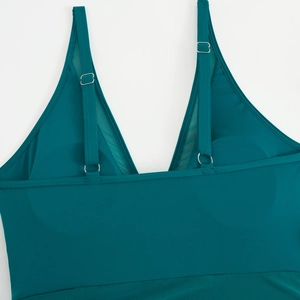 Teal V-neck one-piece swimsuit with adjustable straps and breathable mesh panel details