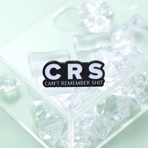 Minimalist enamel brooch with CRS text and acronym on clear ice cube background