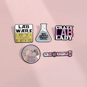 Five-piece STEM scientist enamel pin set featuring science flasks and pink feminist slogans