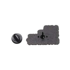 Detailed back view of a metal badge showing the pin and black rubber clutch backing