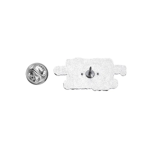 Detailed view of the durable silver metal butterfly clutch and pin back on a brooch