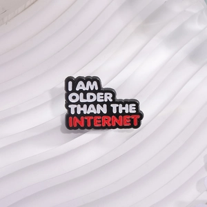 Black enamel pin with I AM OLDER THAN THE INTERNET quote in minimalist style