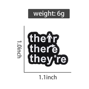 Detail view of enamel brooch dimensions 1.0x1.1 inch with grammar homophones text