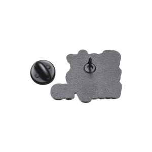 Detail view of the black textured metal brooch back with secure butterfly clutch pin