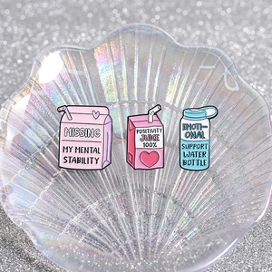 Three-piece cartoon enamel pin set with milk box and drink bottle designs for backpacks