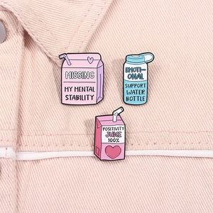 Funny cartoon milk and water bottle enamel pins set on pink denim background