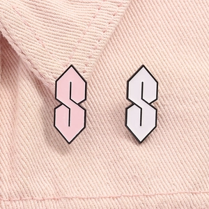 Pink and white Cool S graffiti enamel pins set on pink denim background for clothing