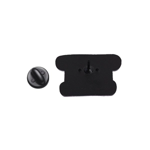 Detail view of the black metal brooch back with secure rubber clutch pin fastener