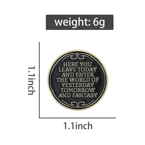 Detail view of 1.1 inch round black enamel brooch with gold trim and weight specifications