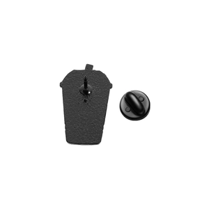 Detail view of the black metal enamel pin back with hammer texture and rubber clutch