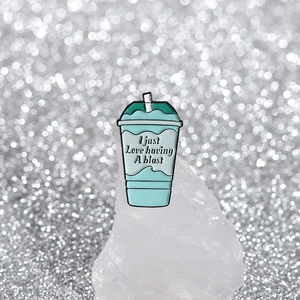 Enamel beverage cup brooch with mint green tones and I Just Love Having A Blast slogan