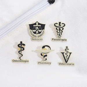 Five medical profession enamel pins including pharmacy and dentistry on white canvas bag