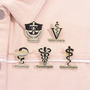 Macro view of five gold medical enamel pins including Dentistry and Pharmacy emblems