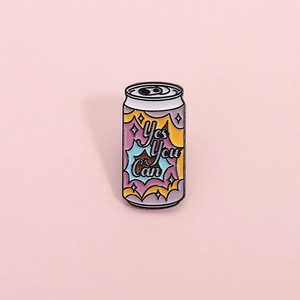 Cartoon soda can enamel pin with Yes You Can motivational quote on pink background