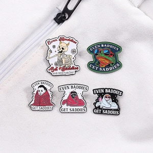 Gothic punk metal enamel pin set with skull and movie characters on white fabric