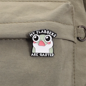 Funny green frog enamel pin featuring MY FLABBERS ARE GASTED text on canvas background