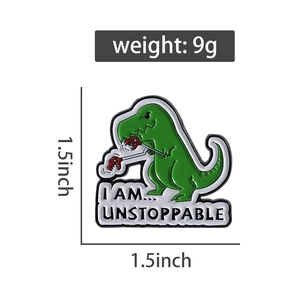 Detail of green dinosaur enamel pin with I Am Unstoppable text, 1.5 inch size and 9g weight