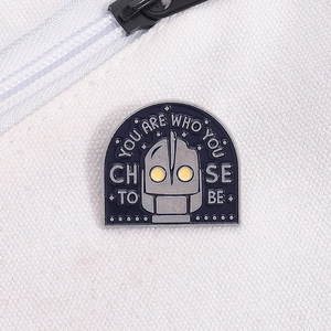 Robot enamel pin on canvas bag with quote You Are Who You Choose To Be