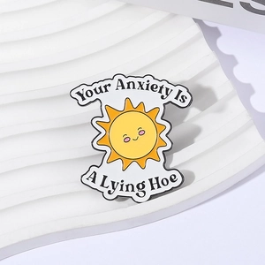 Pin's émaillé soleil avec citation humoristique Your Anxiety Is A Lying Hoe