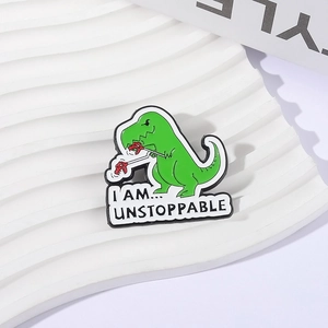 Creative green dinosaur enamel brooch with I AM UNSTOPPABLE motivational text