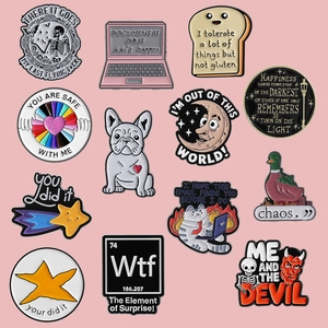 Variety of creative enamel lapel pins with cartoon animal and skull designs on pink background