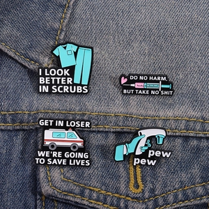 Funny medical enamel pin set with scrubs and ambulance designs on denim jacket