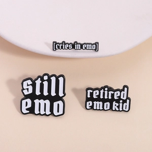 Three-piece set of emo culture black enamel pins featuring gothic typography for backpacks