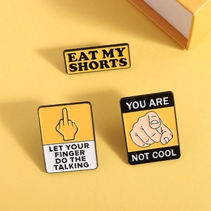 Three funny enamel pins with slogan gestures and quotes on bright yellow background